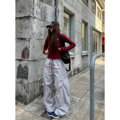 Aiertu 90s American Retro Trend Printed Letters Overalls Women Loose Fold High Street Korean Casual Sports Couple Wide leg Pants Unisex Aiertu
