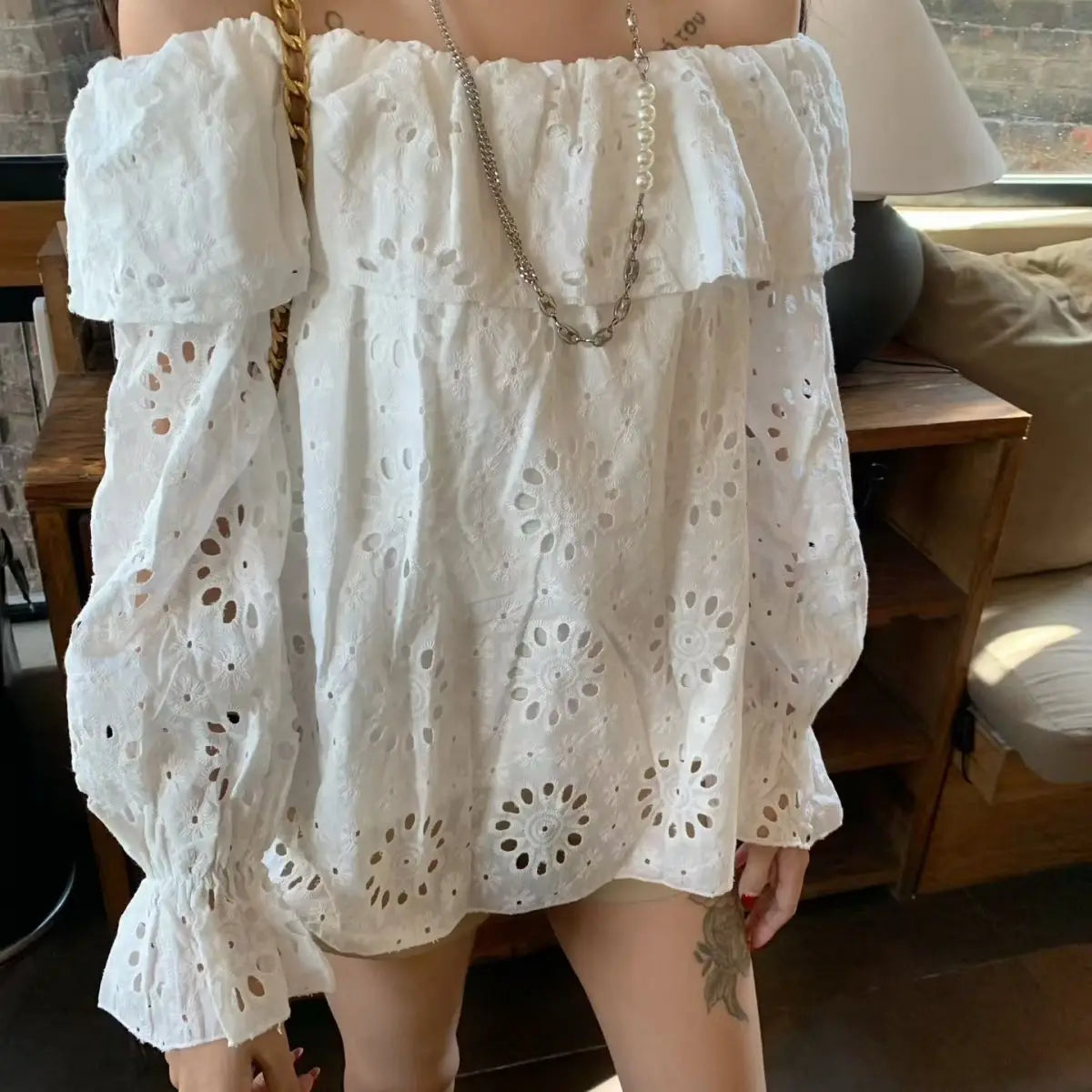 AIERTU - Commuter Style One-word Collar Hollow Embroidered Shirt Women's Spring New Ruffle Edge Loose Wear Top Aiertu
