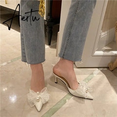 Aiertu New Baotou Half Drag Thin Heel Bow Sandals Pointed Pearl High Heel Muller Shoes Aiertu