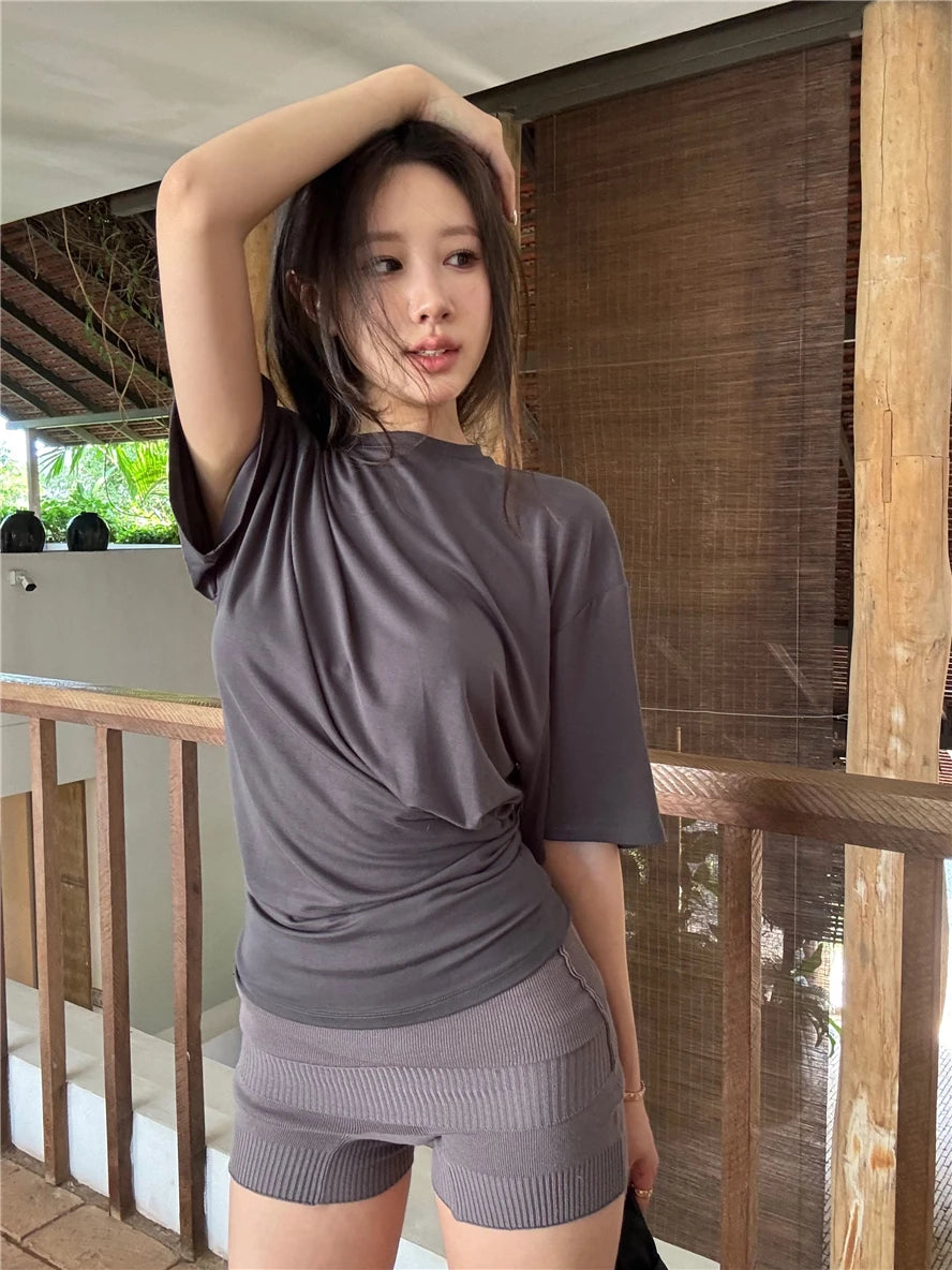 Aiertu  -  O-neck Pleated Asymmetric Casual Short-sleeved T-shirt Women 2026 Summer New High Street Fashion Solid Color All Match Tops Aiertu