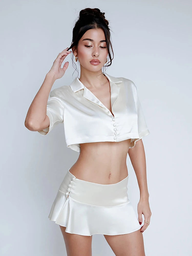 Aiertu  -  Spring New Low Waist Pleated Women Short Skirt White Single Breasted Ruffles Skirt Female Solid Casual Streetwear 2026 Aiertu