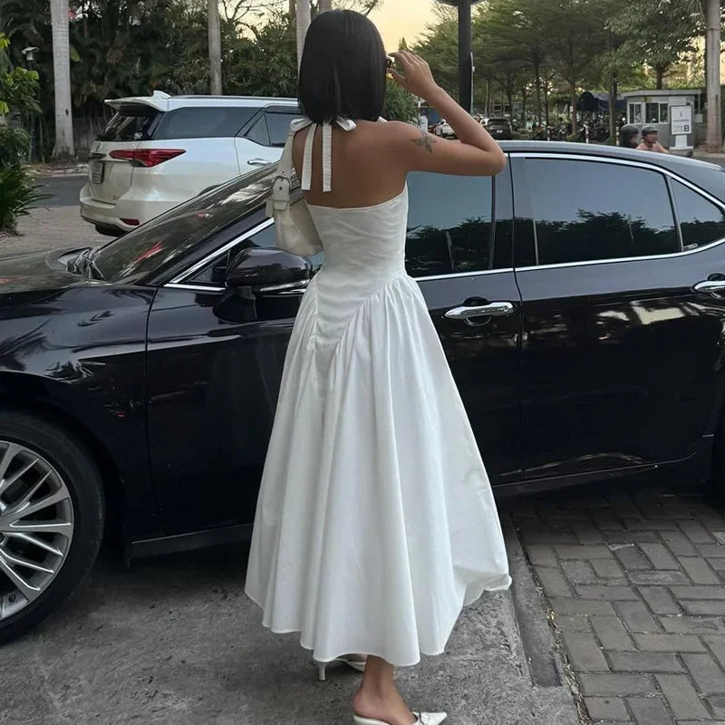 Aiertu  -  Sexy Deep V Hollow Halterneck Large Hem Dress For Women Solid High Waisted Backless Splice Summer New Vacation Long Dress Aiertu