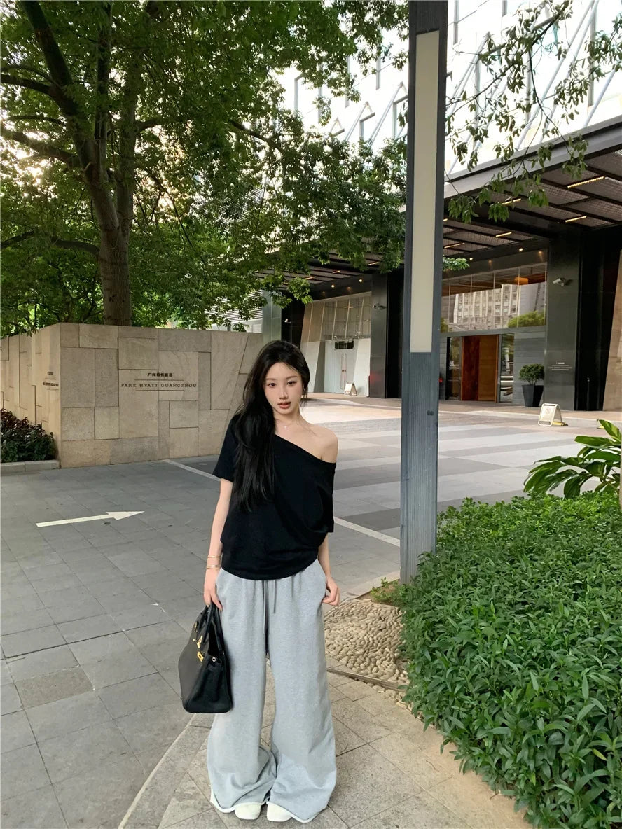 Aiertu  -  Spicy Girl Slant Shoulder Short Sleeve Loose T-shirt 2025 Women's Summer New Casual Irregular Solid Color Versatile Top Aiertu