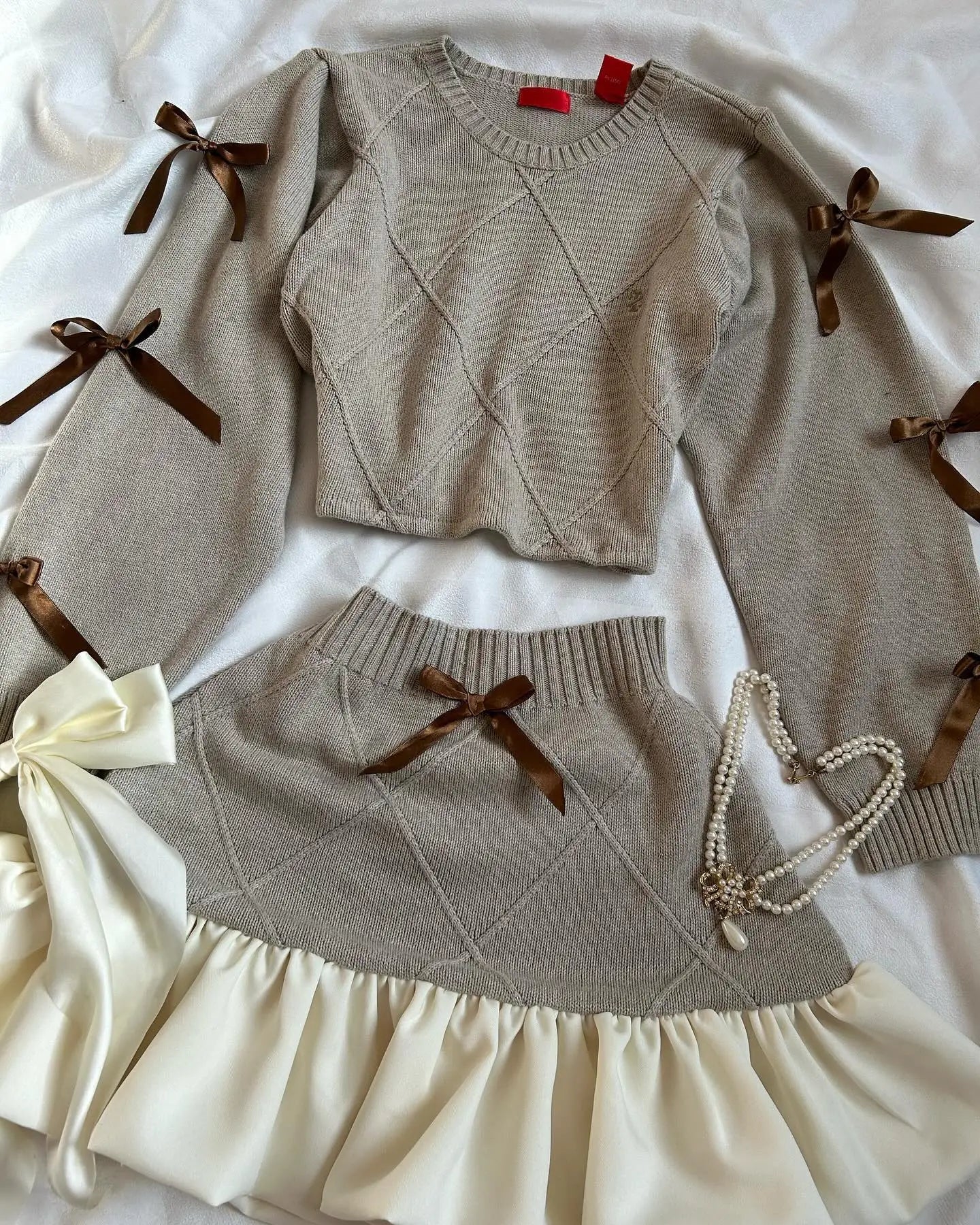 Aiertu  -  Y2K Knitted Splicing Two Piece Set for Women Harajuku Fashion Bow Long Sleeved Knitted Sweatshirt Mini Pleated Skirt Autumn Suit Aiertu