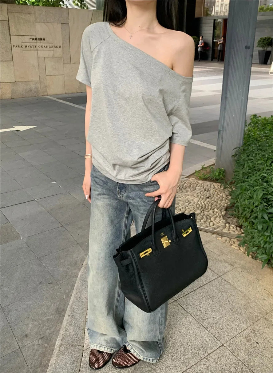 Aiertu  -  Spicy Girl Slant Shoulder Short Sleeve Loose T-shirt 2025 Women's Summer New Casual Irregular Solid Color Versatile Top Aiertu