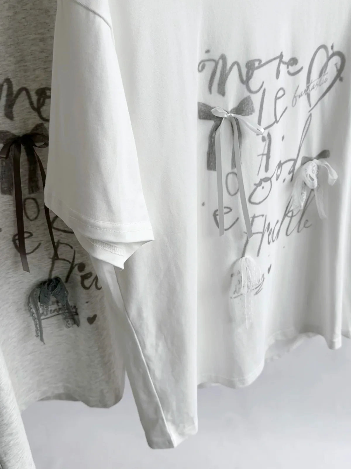 Aiertu  -  Summer new Korean loose letter printing lace bow decoration loose round neck short-sleeved T-shirt Aiertu