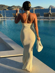 Aiertu  -  Solid  Knitted Halter Backless Long Dress Women Hollow Out Vacation Loose Sexy Dresses 2026 Summer Holiday Party Lady Vestidos Aiertu