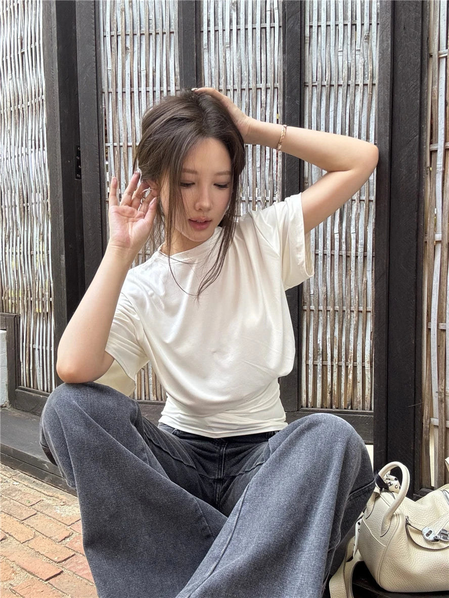 Aiertu  -  O-neck Pleated Asymmetric Casual Short-sleeved T-shirt Women 2026 Summer New High Street Fashion Solid Color All Match Tops Aiertu