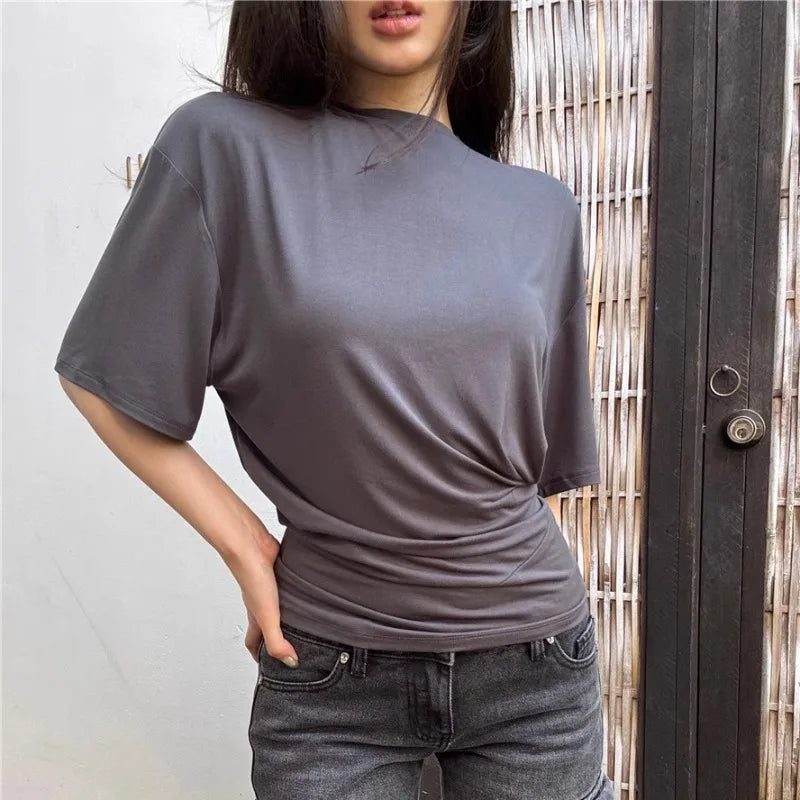 Aiertu  -  O-neck Pleated Asymmetric Casual Short-sleeved T-shirt Women 2026 Summer New High Street Fashion Solid Color All Match Tops Aiertu