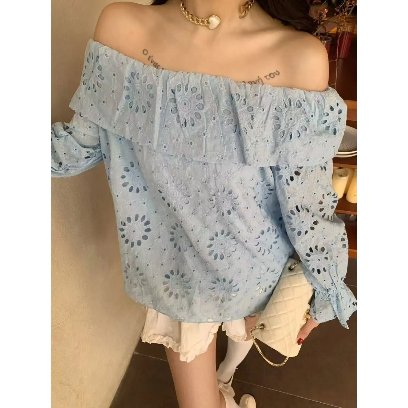 AIERTU  -  Commuter Style One-word Collar Hollow Embroidered Shirt Women's Spring New Ruffle Edge Loose Wear Top Aiertu