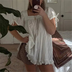 AIERTU  -  Women's Square Neck Puff Sleeve Blouse Loose Fit Ruffle Hem Lace Trim Babydoll Top for Casual Summer Beach and Vacation Outfits Aiertu