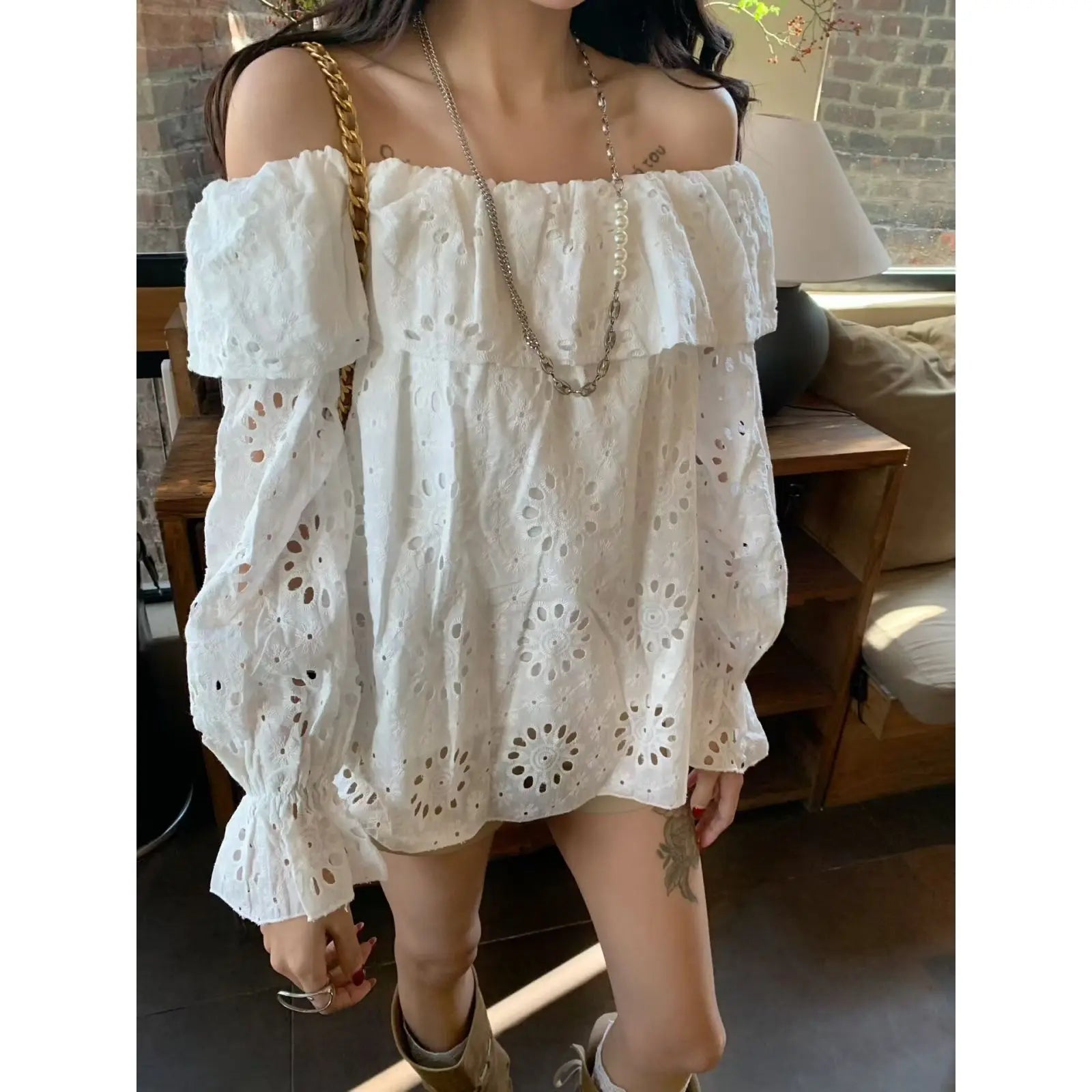 AIERTU  -  Commuter Style One-word Collar Hollow Embroidered Shirt Women's Spring New Ruffle Edge Loose Wear Top Aiertu