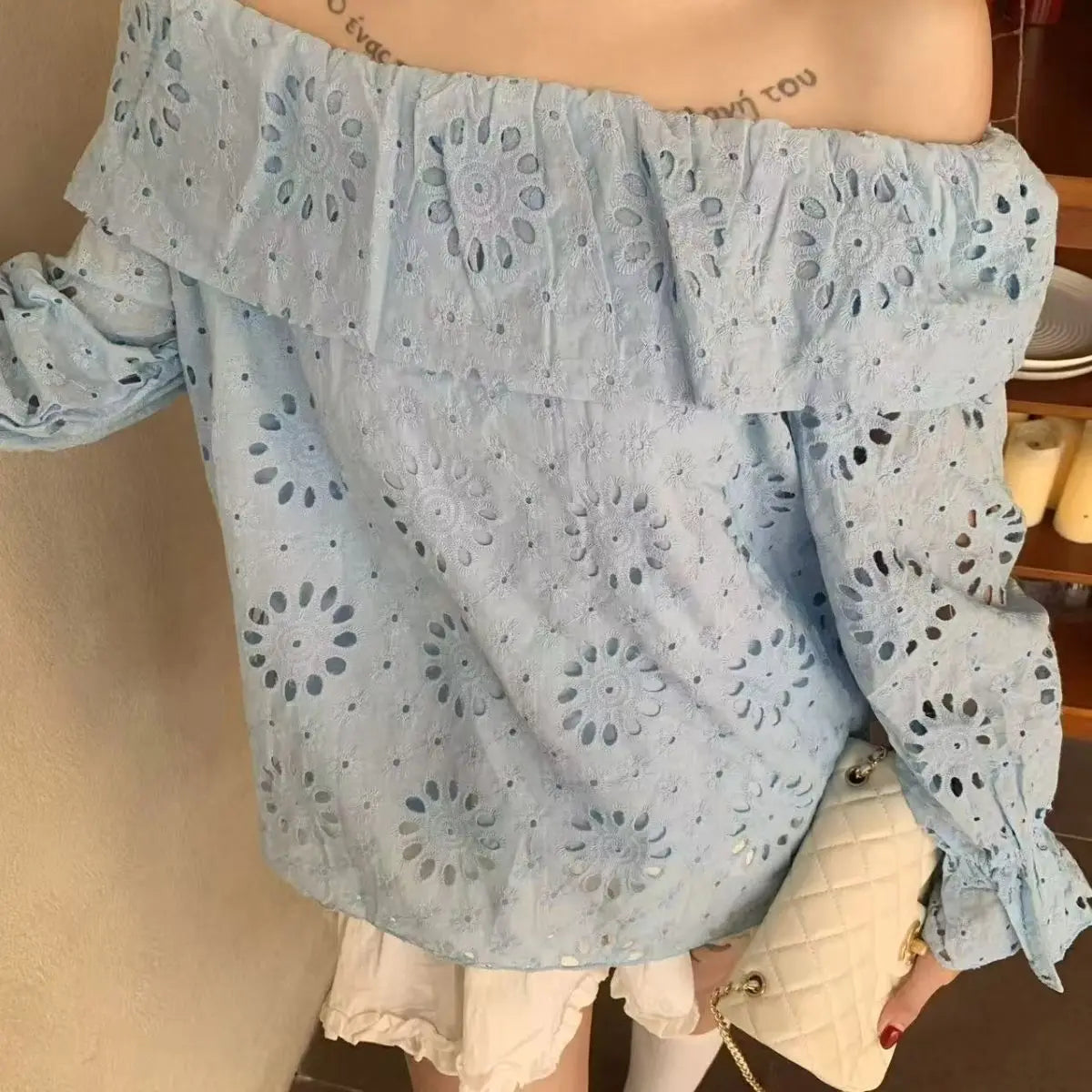 AIERTU  -  Commuter Style One-word Collar Hollow Embroidered Shirt Women's Spring New Ruffle Edge Loose Wear Top Aiertu
