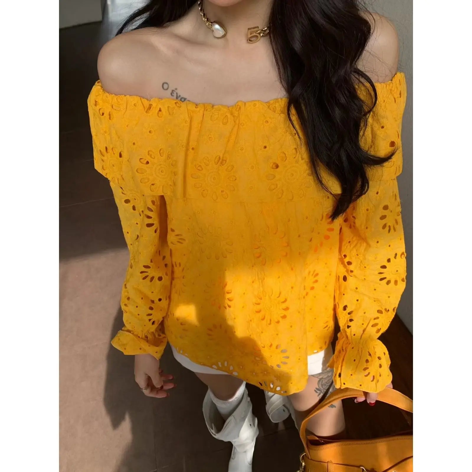AIERTU  -  Commuter Style One-word Collar Hollow Embroidered Shirt Women's Spring New Ruffle Edge Loose Wear Top Aiertu