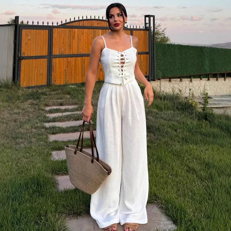 Aiertu  -  Strap Camisole Vest High Waist Pants Women Suit Sexy Hollow Top Straight Tube Loose trousers 2026 Summer Vacation Casual Set Aiertu