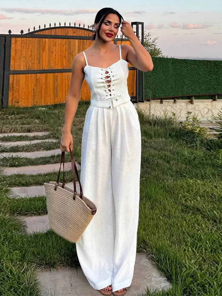 Aiertu  -  Strap Camisole Vest High Waist Pants Women Suit Sexy Hollow Top Straight Tube Loose trousers 2026 Summer Vacation Casual Set Aiertu