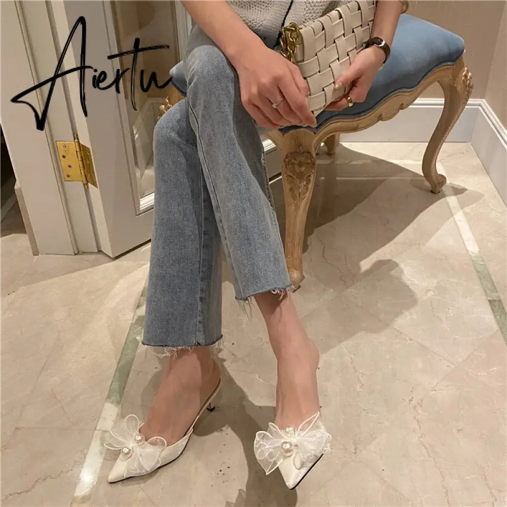 Aiertu New Baotou Half Drag Thin Heel Bow Sandals Pointed Pearl High Heel Muller Shoes Aiertu