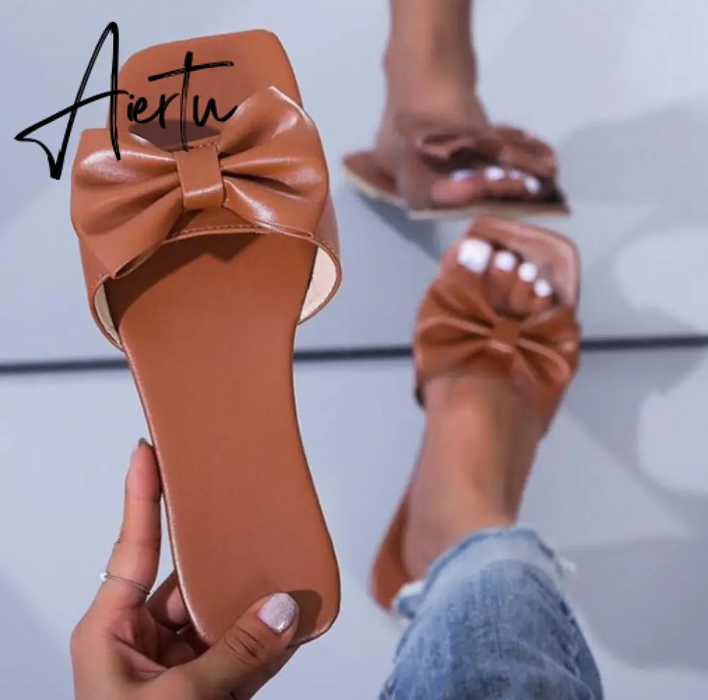 Aiertu  Spring/summer new outdoor flat leather bow non-slip beach lady slippers casual all-match fashion women sandals Aiertu