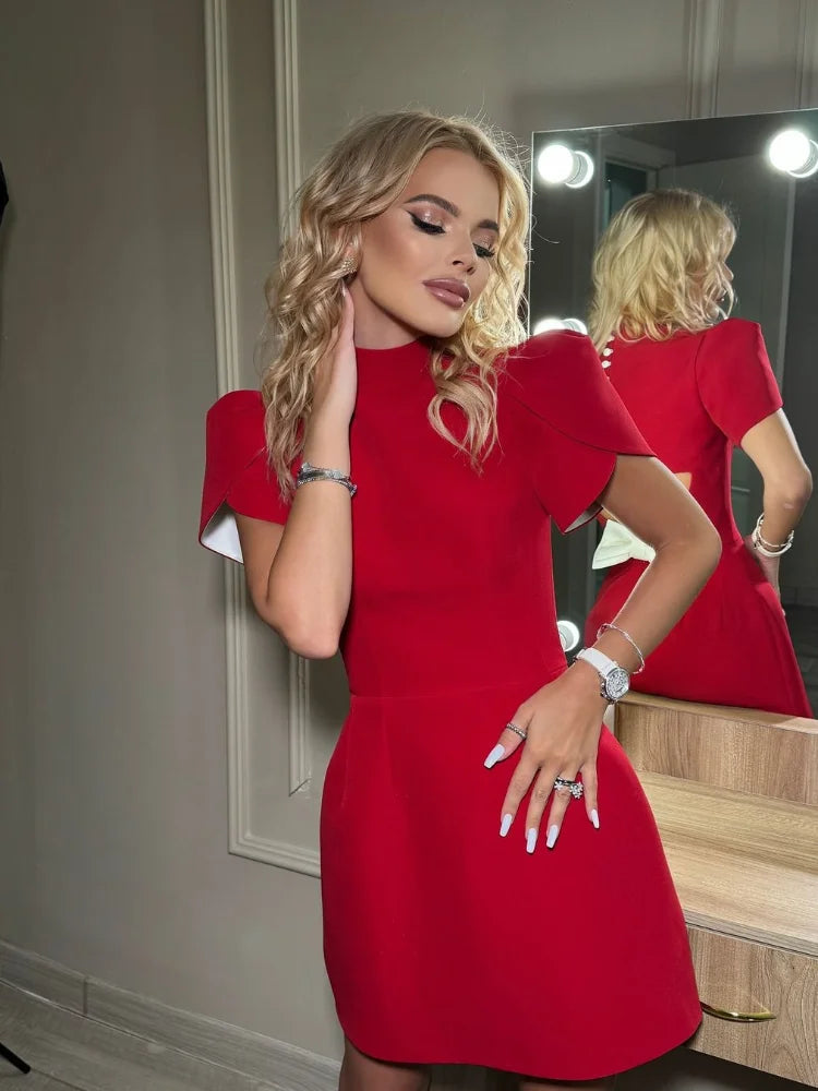 Aiertu  -  Fashion Back Bow Buttons Mini Dress For Women Fashion Backless O-neck Short Sleeves A-line Dresses 2026 Lady Elegant Party Robes Aiertu
