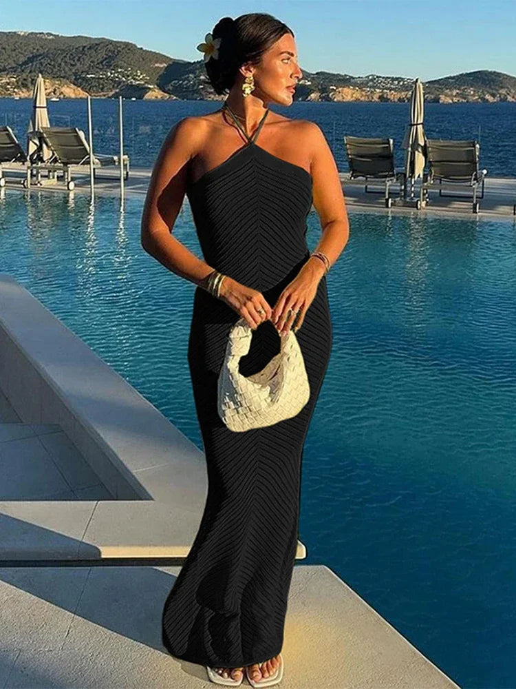 Aiertu  -  Solid  Knitted Halter Backless Long Dress Women Hollow Out Vacation Loose Sexy Dresses 2026 Summer Holiday Party Lady Vestidos Aiertu