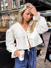 Aiertu  -  Cotton Bow Lace Up Shirt Women Elegant V-neck Hollow Out Long Lantern Sleeve Shirts 2026 Spring Summer Casual Loose Fashion Tops Aiertu